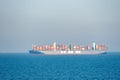 Container ship `HMM Algeciras` sailing through calm blue ocean. Royalty Free Stock Photo