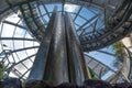 Etal modern tower waterfall inside modernist glass dome