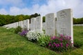 Etaples Military Cemetery in France - headstones with flowers and cross Royalty Free Stock Photo