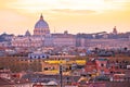 Eternal city of Rome rooftops and Vatican Basilica of Saint Peter golden sunset view