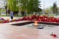 Eternal fire against flowers after May 9th day of great victory, celebration of the victory in the second world war