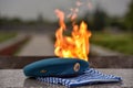Eternal flame, blue beret and vest Royalty Free Stock Photo
