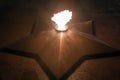 Eternal flame in five pointed star symbol of memory fallen soldiers