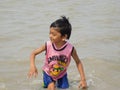 Eternal Happiness , kid playing in sea water