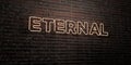 ETERNAL -Realistic Neon Sign on Brick Wall background - 3D rendered royalty free stock image