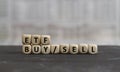 ETF buy and sell written on wooden cubes