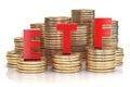 ETF exchange traded fund onthe stacks of golden coins. Stock exchenge and investment concept.