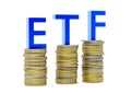 ETF - exchange traded funds - acronym on stacks of coins over white background Royalty Free Stock Photo