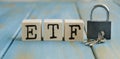 ETF word written on wood block on chart background Royalty Free Stock Photo
