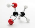 Ethanoic Acid molecule with red and black balls on a white background