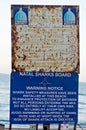 Ethekwini Municipality notice and Natal Sharks Board Warning Notice on the promenade at Umhlanga Rocks