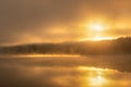 Ethereal moody sunrise with fog and steam being illuminated over a lake. Croton Gorge Royalty Free Stock Photo