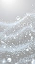 Ethereal scene with numerous translucent particles and bubbles suspended in a light gray Floating particle background Royalty Free Stock Photo