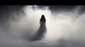 Ethereal Silhouette: A Hauntingly Beautiful Image Of A Woman Emerging From The Mist