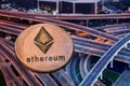 ethereum against skyscrapers - futuristic smart city - cryptocurrency concept