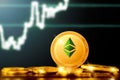 ETHEREUM classic ETC cryptocurrency; ETHEREUM classic golden coin on the background of the chart