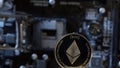 Ethereum coin on computer motherboard background, cryptocurrency mining, virtual money