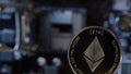 Ethereum coin on computer motherboard background, cryptocurrency mining, virtual money