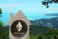 Ethereum coin in a metal house