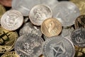 Ethereum Coin mixed with US Dollar Coins. Crypto Currency and Dollars. Half Dollar, Eisenhower Dollar and Gold Bitcoin Coin