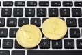 Ethereum coins on laptop keyboard. Cryptocurrency. Selective focus