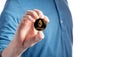 Man holding an Ether Ethereum coin on a white background