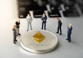 Ethereum ETH Coin and businessmans on notebook.