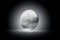 Ethereum ETH coin with Ether sign on a gently lit dark background