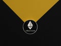 Ethereum or eth silver coin on black and yellow background. Cryptocurrency and crypto concept of etherum Royalty Free Stock Photo
