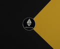 Ethereum or eth silver coin on black and yellow background. Cryptocurrency and crypto concept of etherum Royalty Free Stock Photo