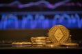 Ethereum gold coin and defocused chart background. Royalty Free Stock Photo