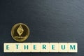 Ethereum gold coin with text made out of letter tiles