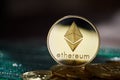 Ethereum on the pile of cryptocurrency on wooden table as most important cryptocurrency concept.