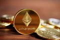 Ethereum on the pile of cryptocurrency on wooden table as most important cryptocurrency concept.