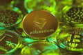 Ethereum silver coin against the background of other golden coins. Electronic virtual cryptocurrency for online banking. Royalty Free Stock Photo