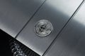 Ethereum silver crypto coin lies on the metalic surface