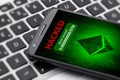 ethereum wallet hacked message on smartphone screen.