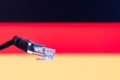 Ethernet cable with German flag in the background Royalty Free Stock Photo