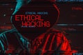 Ethical hacking concept with faceless hooded male person Royalty Free Stock Photo