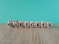 Ethical or legal rights symbol. Turned wooden cubes and changes words ethical rights to legal rights on a beautiful blue Royalty Free Stock Photo