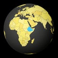 Ethiopia on dark globe with yellow world map.