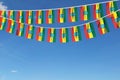 Ethiopia flag festive bunting hanging against a blue sky. 3D Render