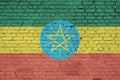 Ethiopia flag is painted onto an old brick wall Royalty Free Stock Photo