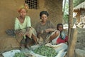 Village life Ethiopian mother and girl clean herbs