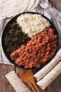 Ethiopian kitfo: marinated beef with herbs and cheese close-up a