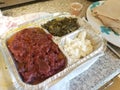 Ethiopian kitfo raw beef in tray with cheese and greens