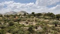 Ethiopian landscape of grass huts and mountains in the Borana region of Ethiopia