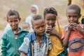 Ethiopian teenager boys posing to tourists