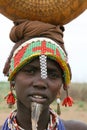 Ethiopian woman carrying goods on head