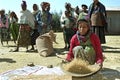 Ethiopian woman separate chaff from the grain Royalty Free Stock Photo